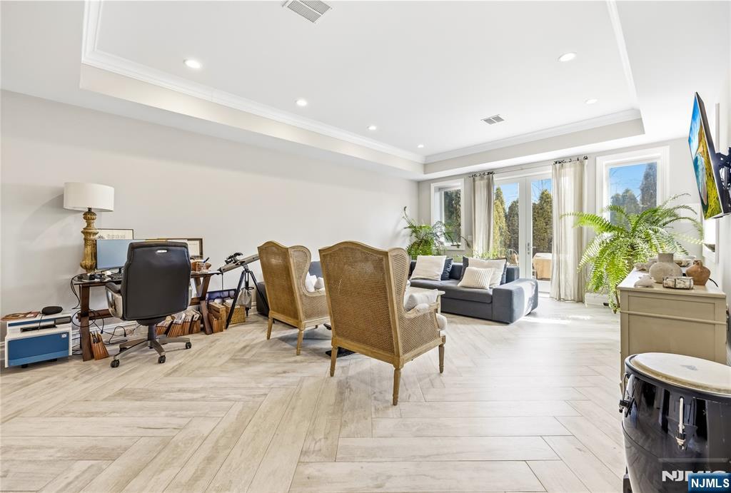 1228 River Road Edgewater, NJ 07020 - Photo 25 of 49 a living room with furniture and a flat screen tv