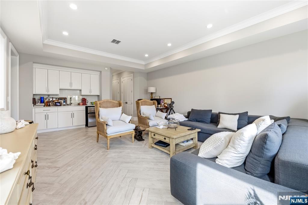 1228 River Road Edgewater, NJ 07020 - Photo 26 of 49 a living room with furniture or kitchen view and a wooden floor