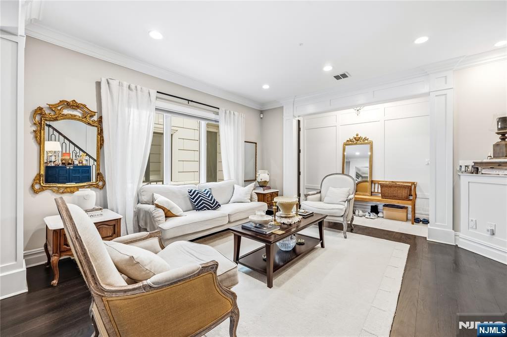 1228 River Road Edgewater, NJ 07020 - Photo 3 of 49 a living room with furniture and a flat screen tv