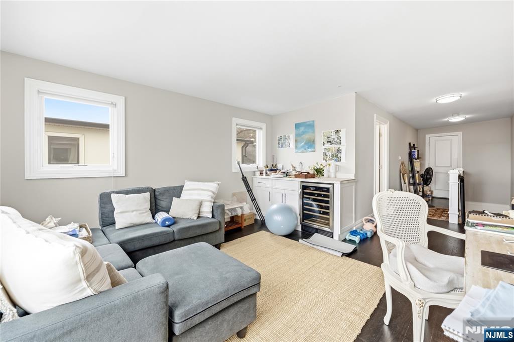 1228 River Road Edgewater, NJ 07020 - Photo 33 of 49 a living room with furniture and a flat screen tv