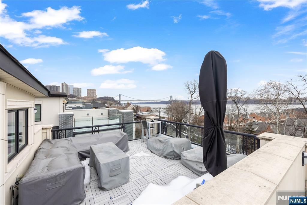 1228 River Road Edgewater, NJ 07020 - Photo 36 of 49 a view of a terrace with furniture