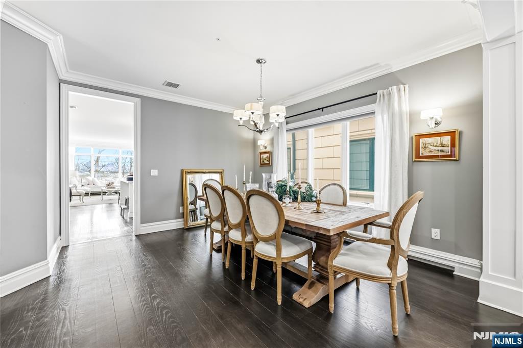 1228 River Road Edgewater, NJ 07020 - Photo 4 of 49 a view of a dining room with furniture window and wooden floor