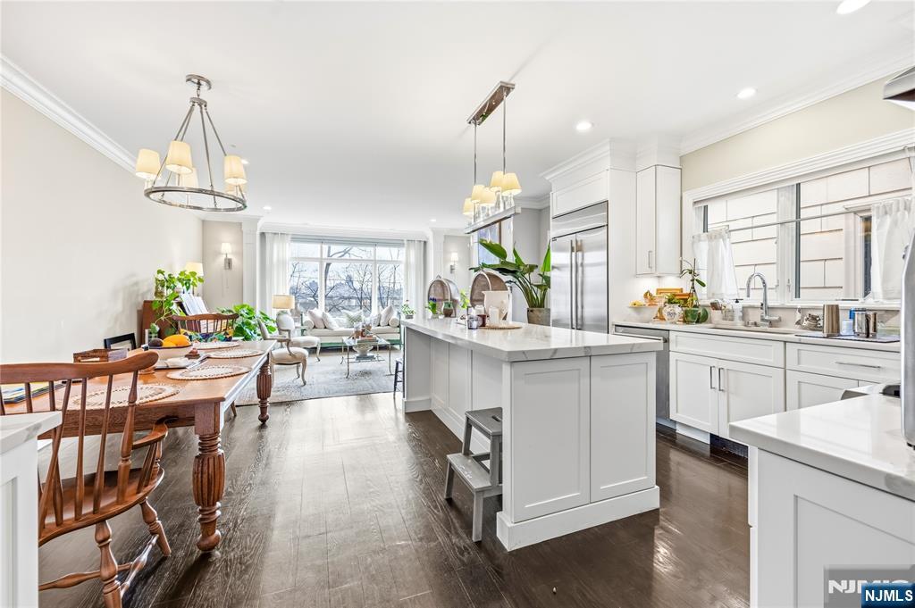 1228 River Road Edgewater, NJ 07020 - Photo 6 of 49 a kitchen with sink cabinets and window