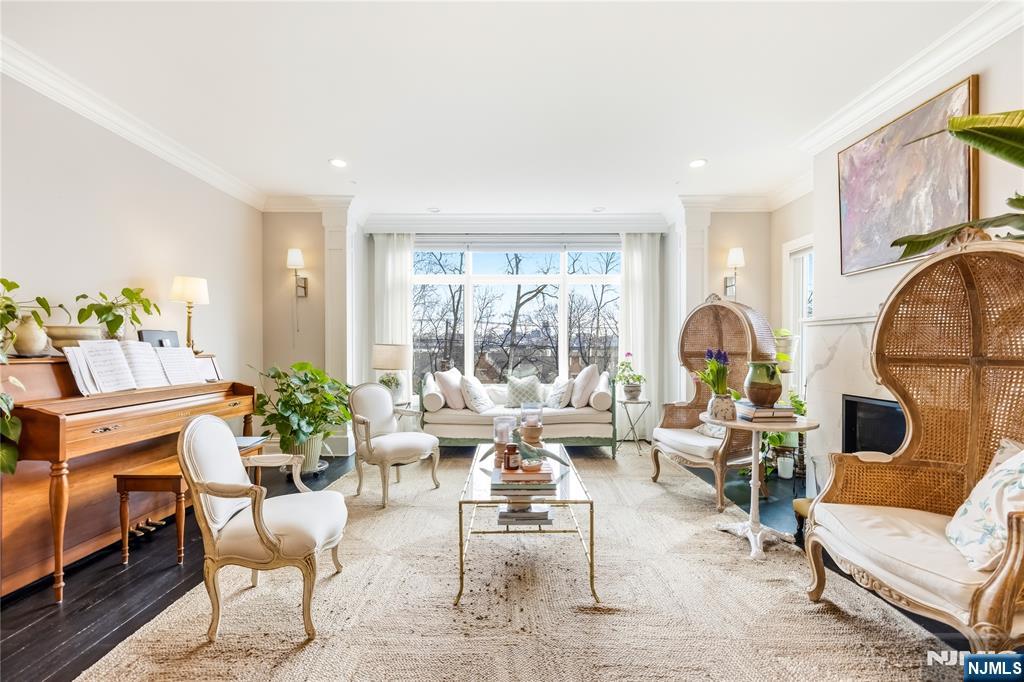 1228 River Road Edgewater, NJ 07020 - Photo 10 of 49 a living room with furniture and a large window