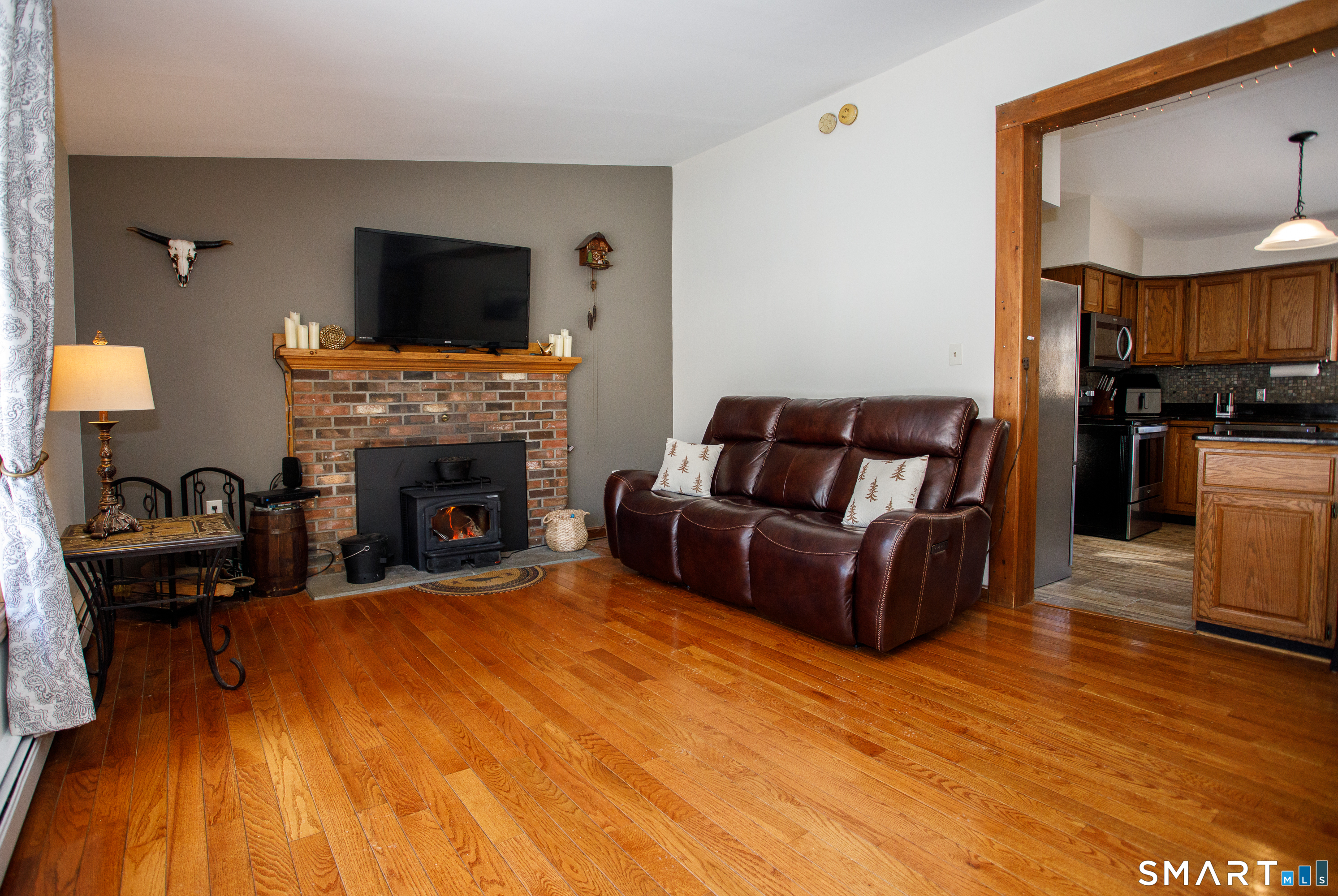 110 Pautipaug Hill Road Sprague, CT 06330 - Photo 14 of 33 a living room with furniture and a fireplace