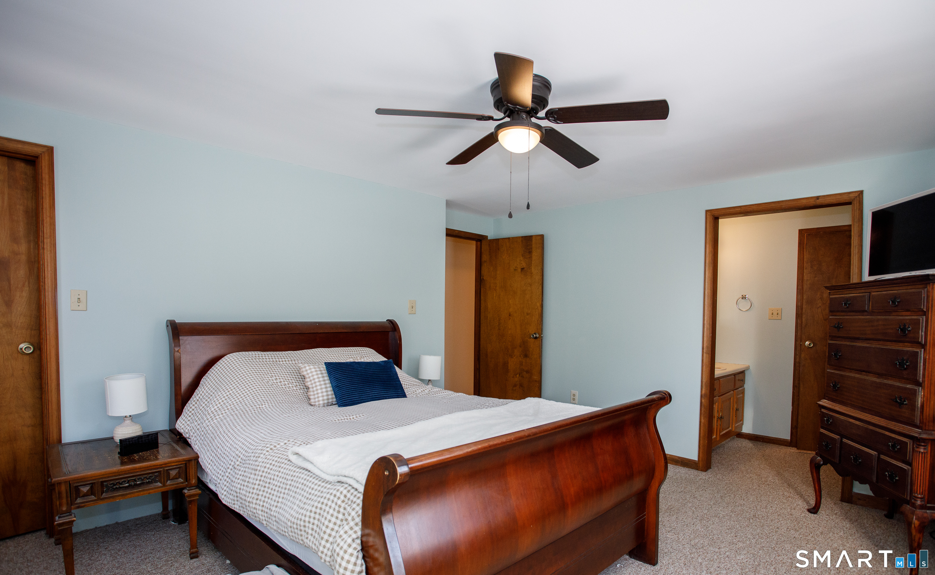 110 Pautipaug Hill Road Sprague, CT 06330 - Photo 19 of 33 a bedroom with a bed and a chandelier