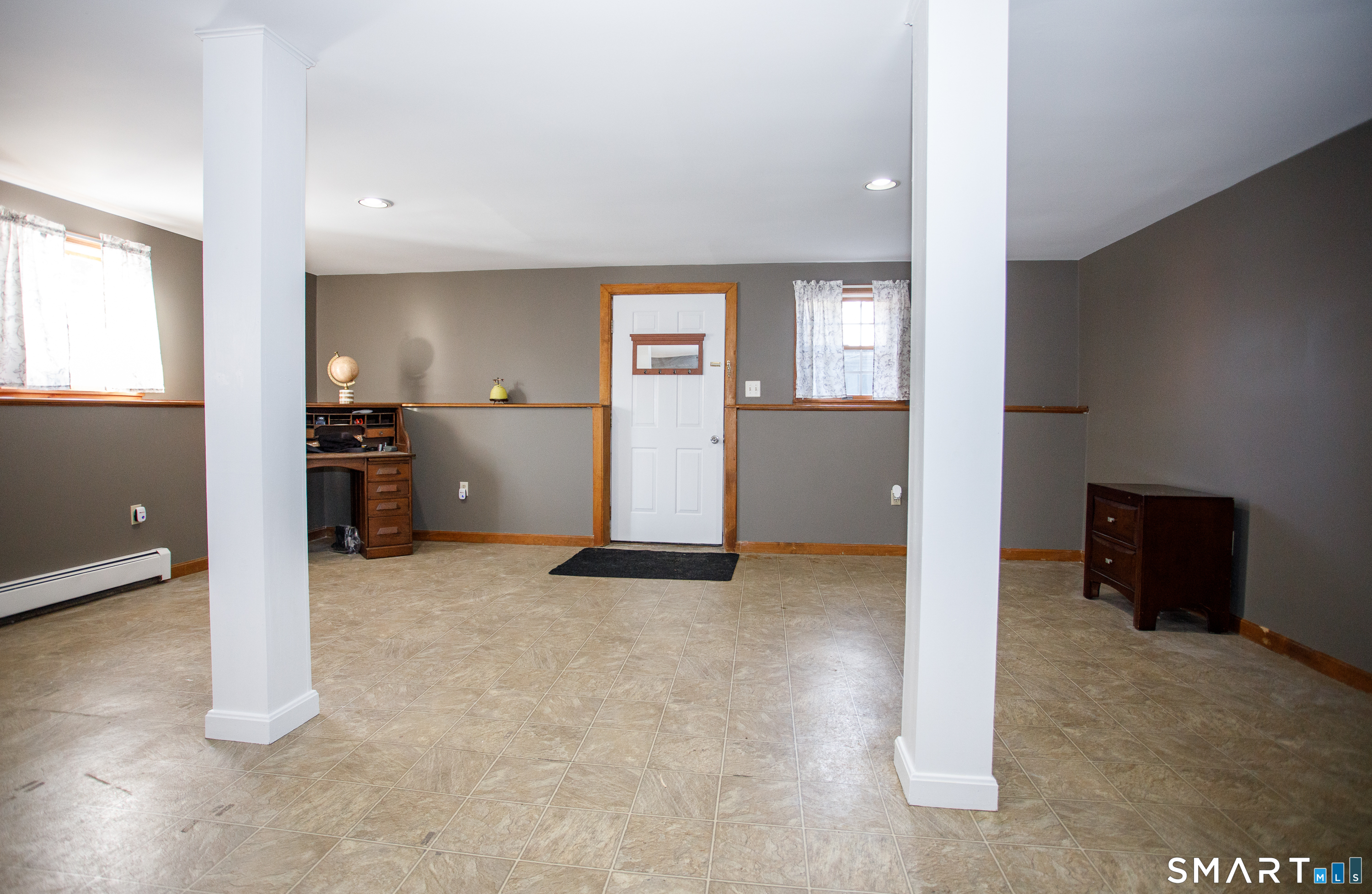 110 Pautipaug Hill Road Sprague, CT 06330 - Photo 25 of 33 an empty room with furniture and windows