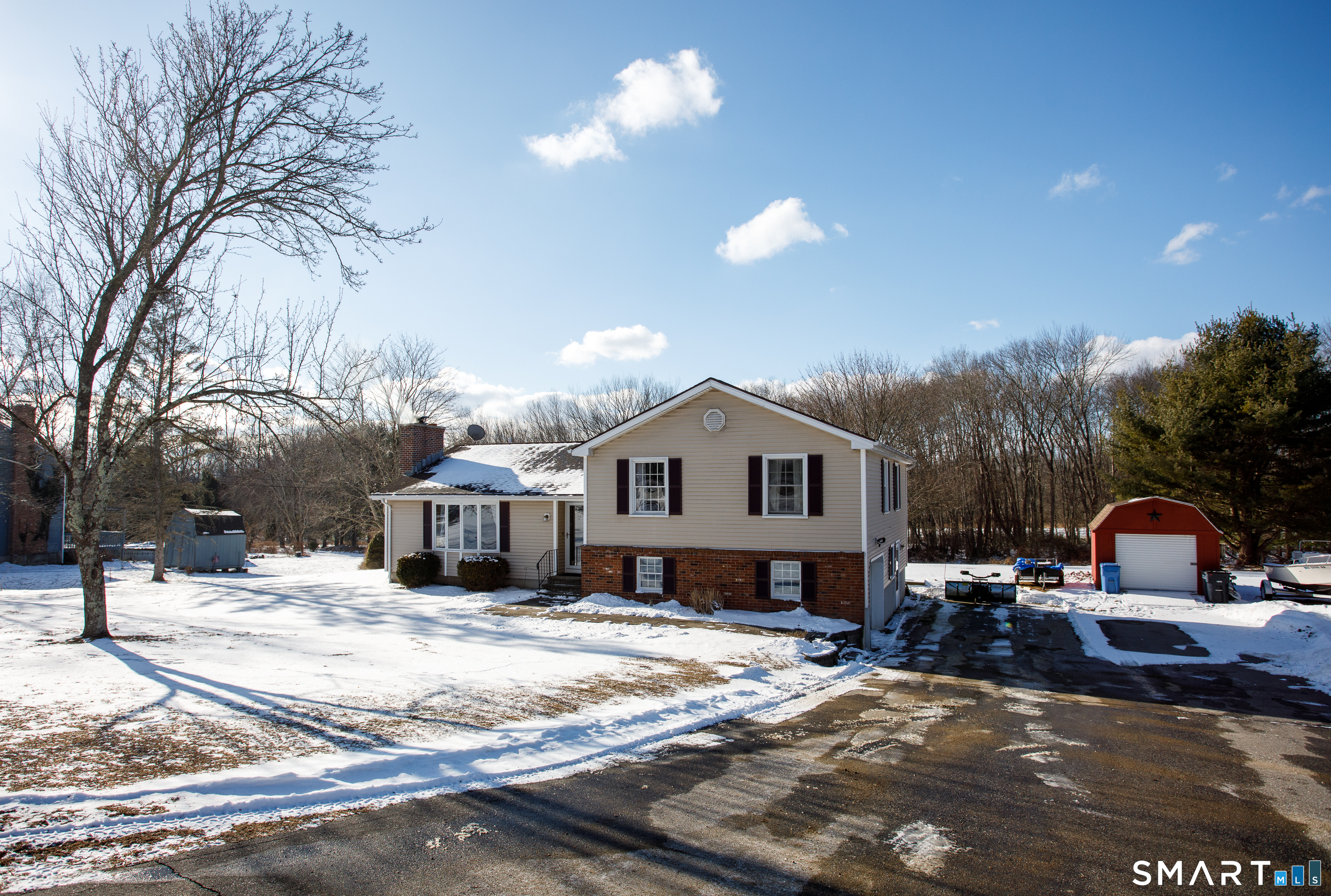 110 Pautipaug Hill Road Sprague, CT 06330 - Photo 32 of 33 a view of a house with a yard covered in snow