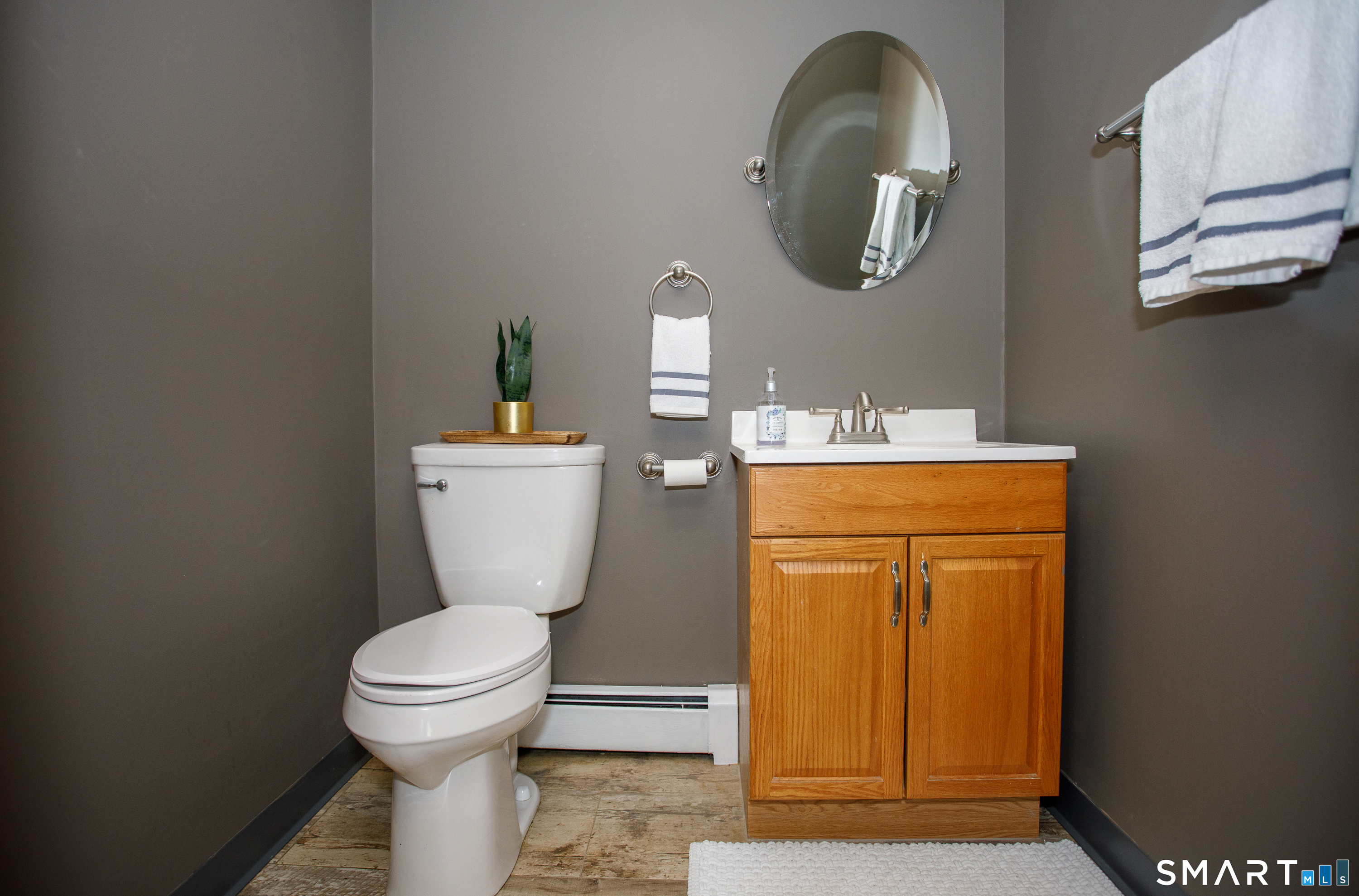 110 Pautipaug Hill Road Sprague, CT 06330 - Photo 9 of 33 a bathroom with a toilet sink and mirror