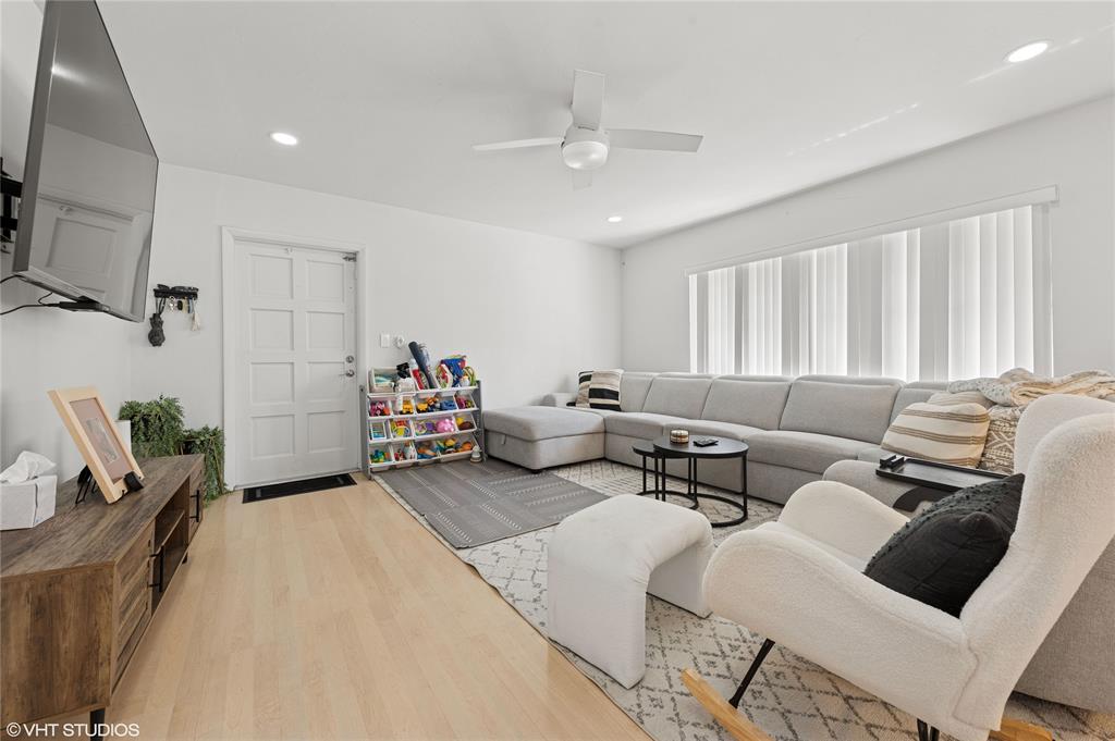 Undisclosed Address Lighthouse Point, FL 33064 - Photo 4 of 13 a living room with furniture and a flat screen tv