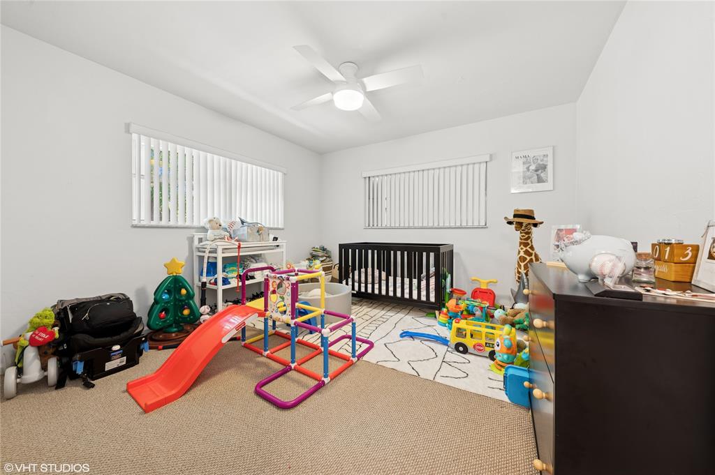 Undisclosed Address Lighthouse Point, FL 33064 - Photo 9 of 13 a play room with toys and a couch