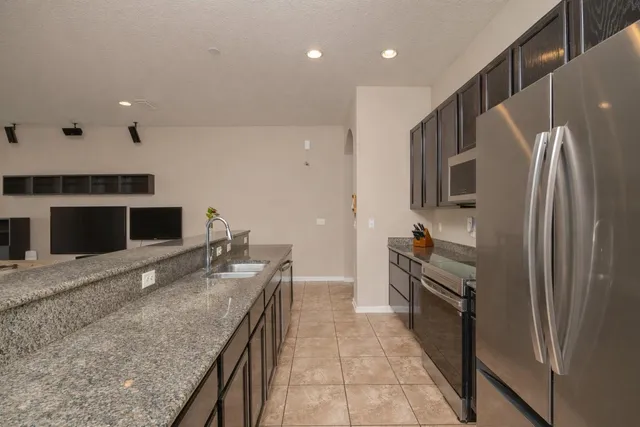 a bathroom with a tub a sink and mirror