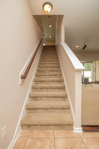 a view of a house with a small yard and plants