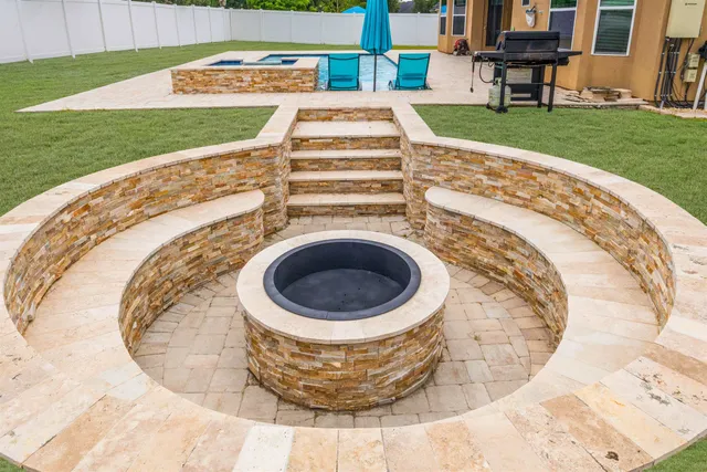 a view of a house with a yard and large tree