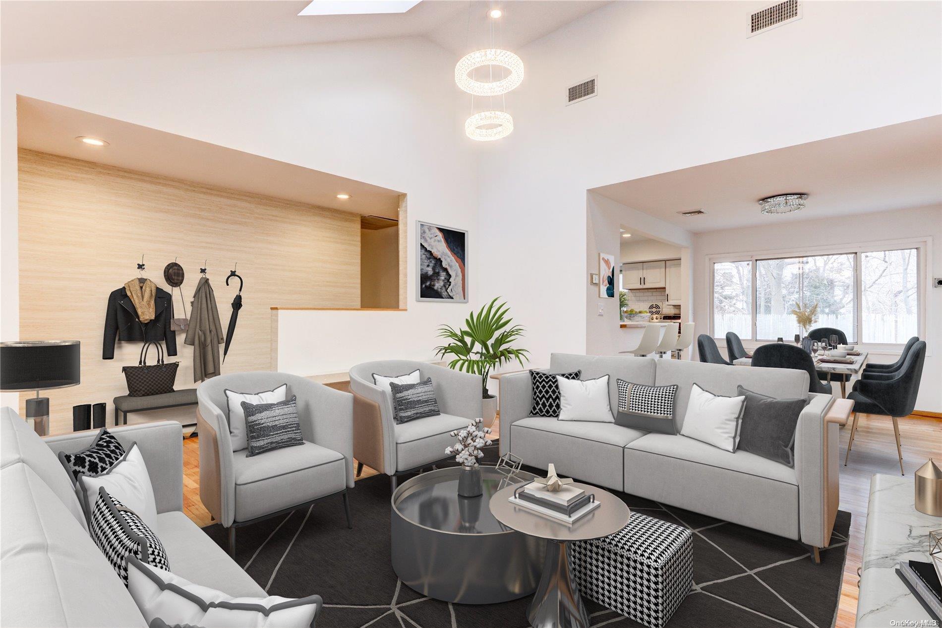 a living room with furniture potted plant and a large window