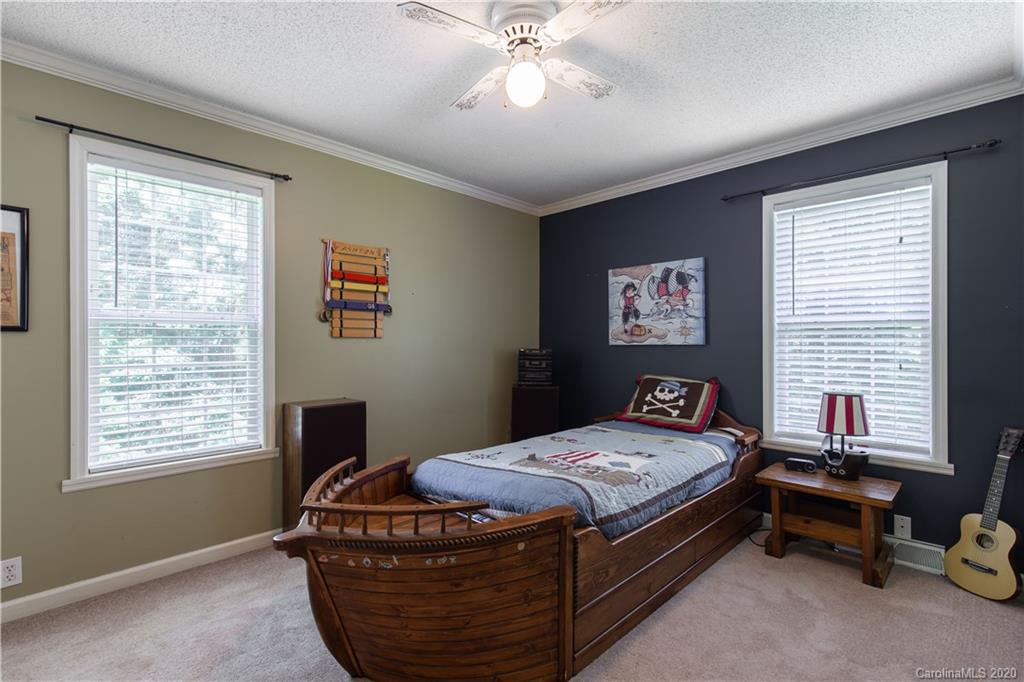 2229 Flat Creek Road Lancaster, SC 29720 - Photo 14 of 29 a bedroom with a bed and a window