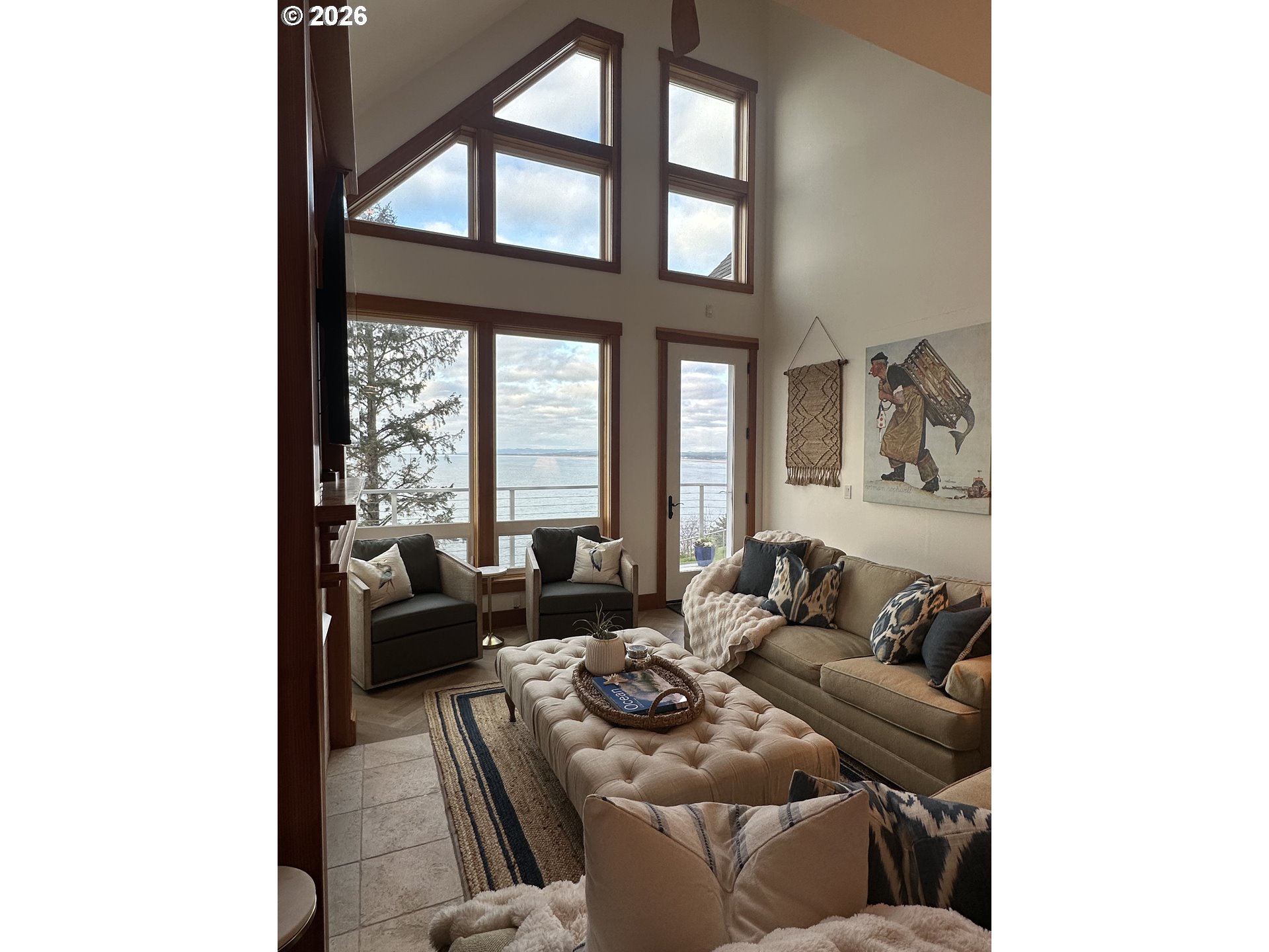 3912 Sunset Boulevard, Unit A202 Seaside, OR 97138 - Photo 13 of 32 a living room with furniture and a large window