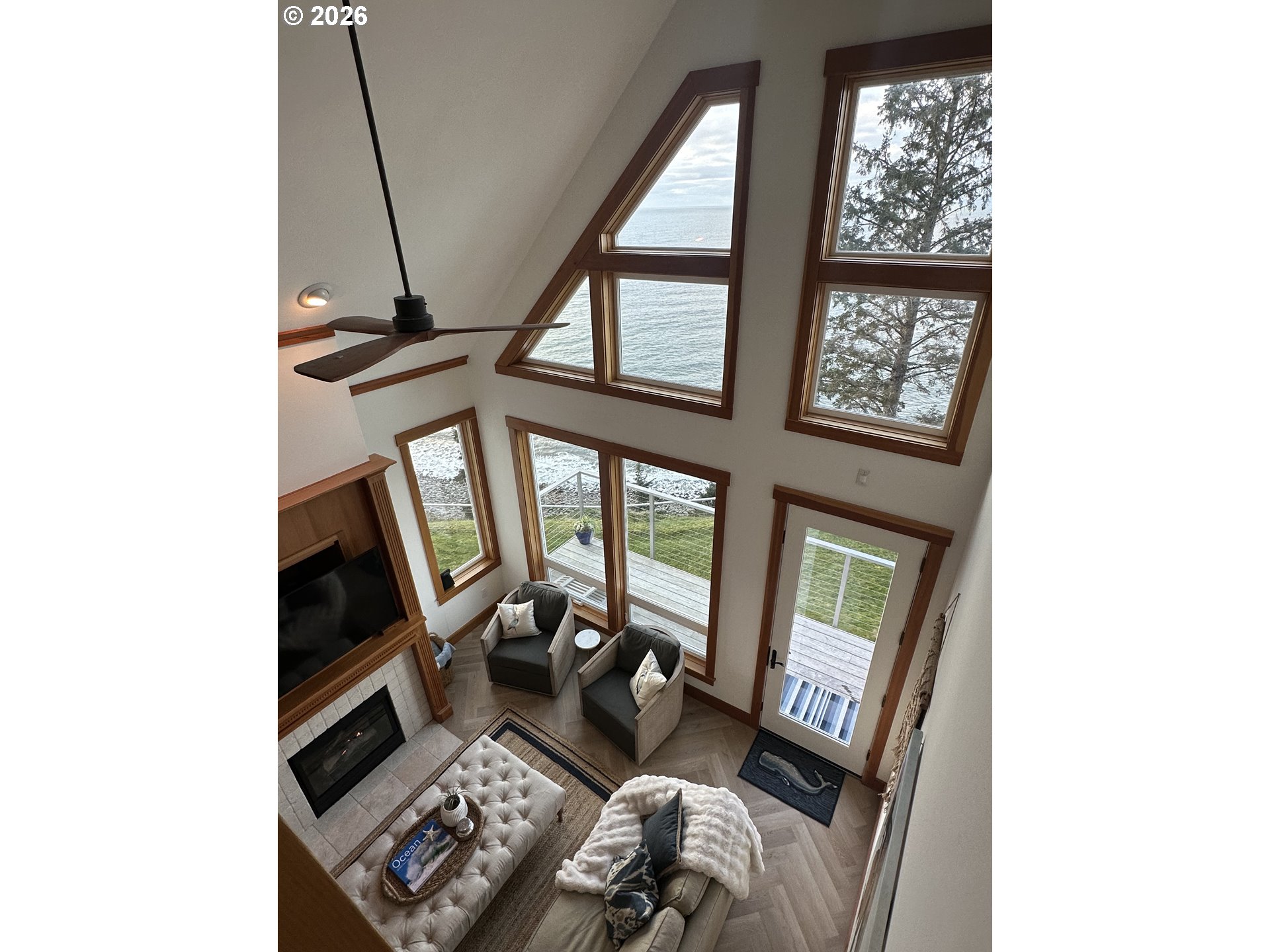 3912 Sunset Boulevard, Unit A202 Seaside, OR 97138 - Photo 22 of 32 a living room with furniture and a window