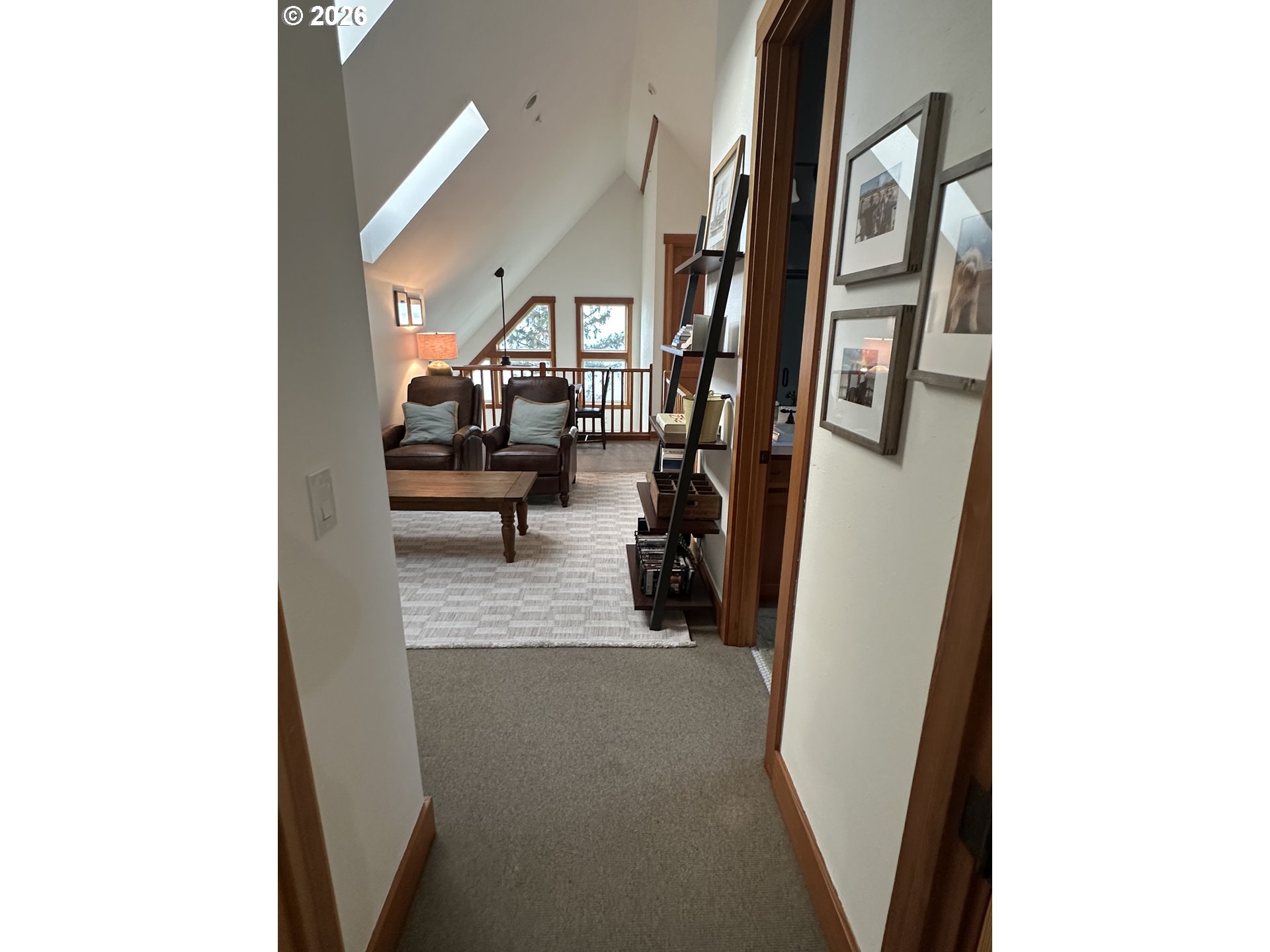 3912 Sunset Boulevard, Unit A202 Seaside, OR 97138 - Photo 27 of 32 a living room with furniture and a gate