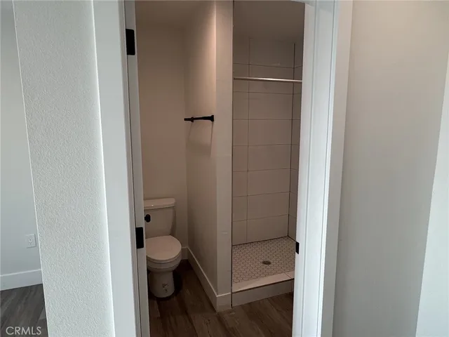 a bathroom with a granite countertop toilet