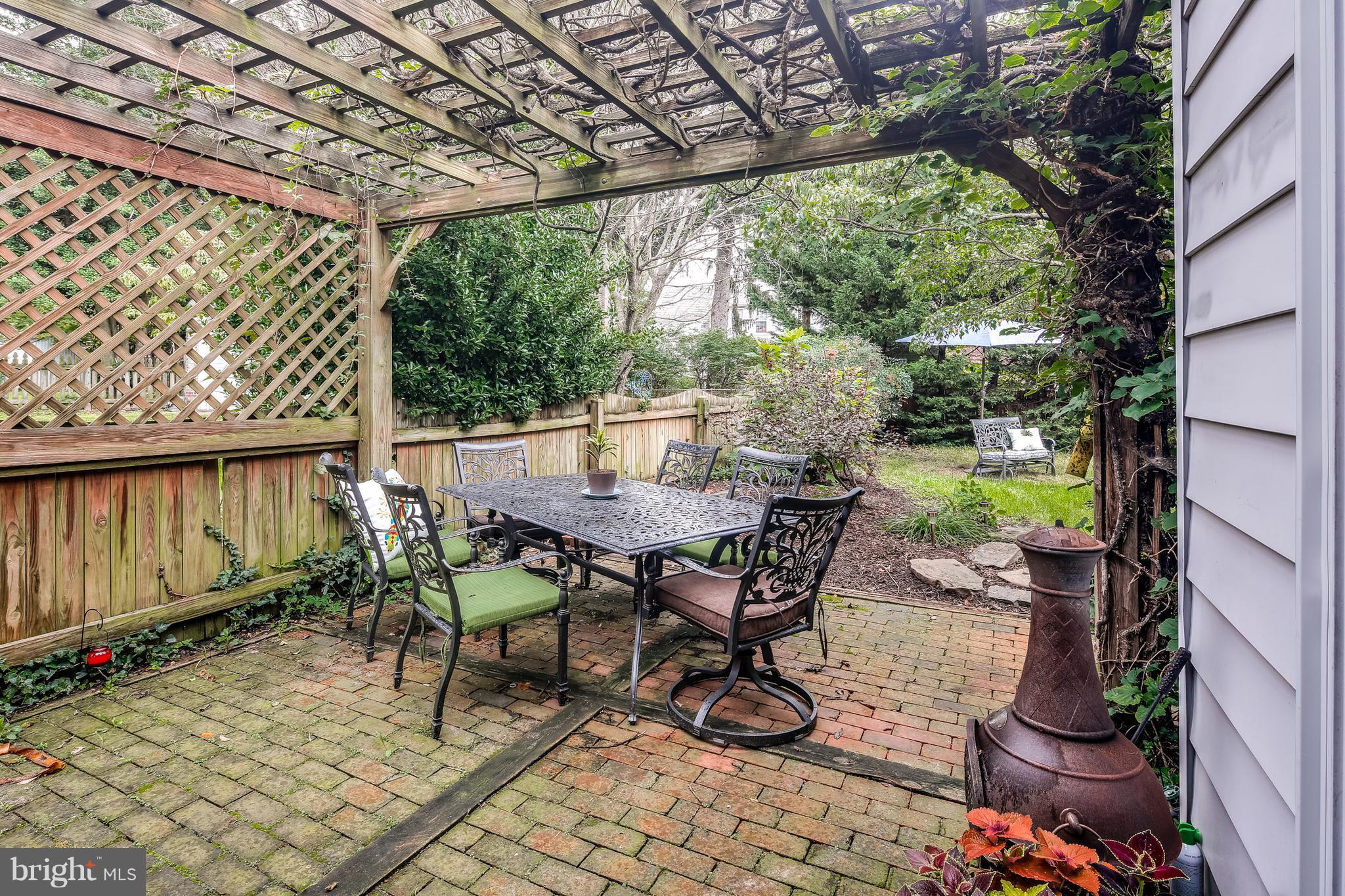 14 Tanglewood Road Baltimore, MD 21228 - Photo 11 of 26 Brick patio, pergula, flowers! Beautiful!