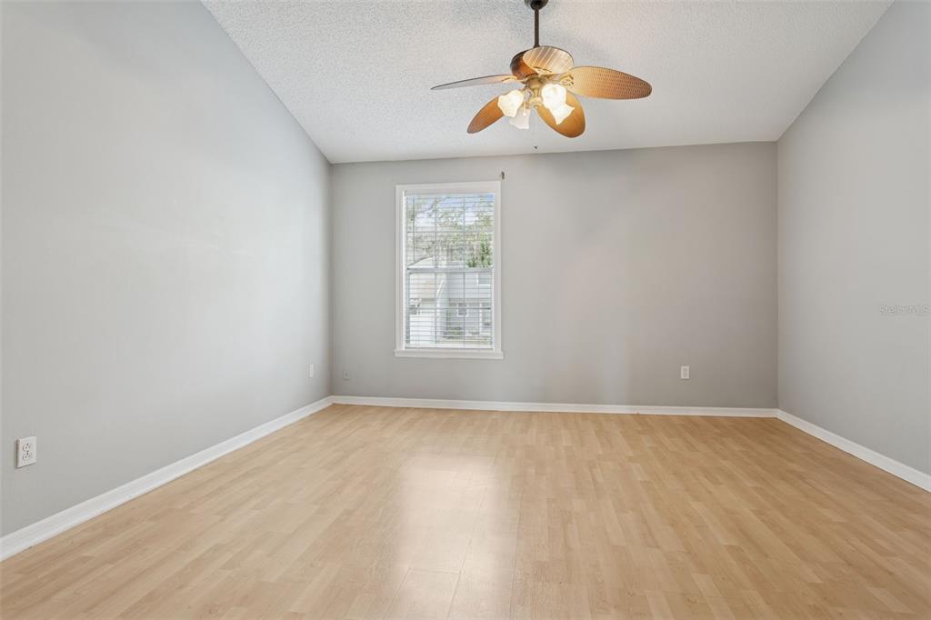 11356 Stratton Park Drive Temple Terrace, FL 33617 - Photo 18 of 25 a view of an empty room with window and chandelier fan