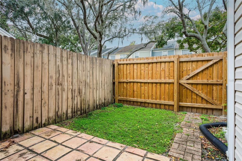 11356 Stratton Park Drive Temple Terrace, FL 33617 - Photo 22 of 25 a backyard of a house with wooden fence