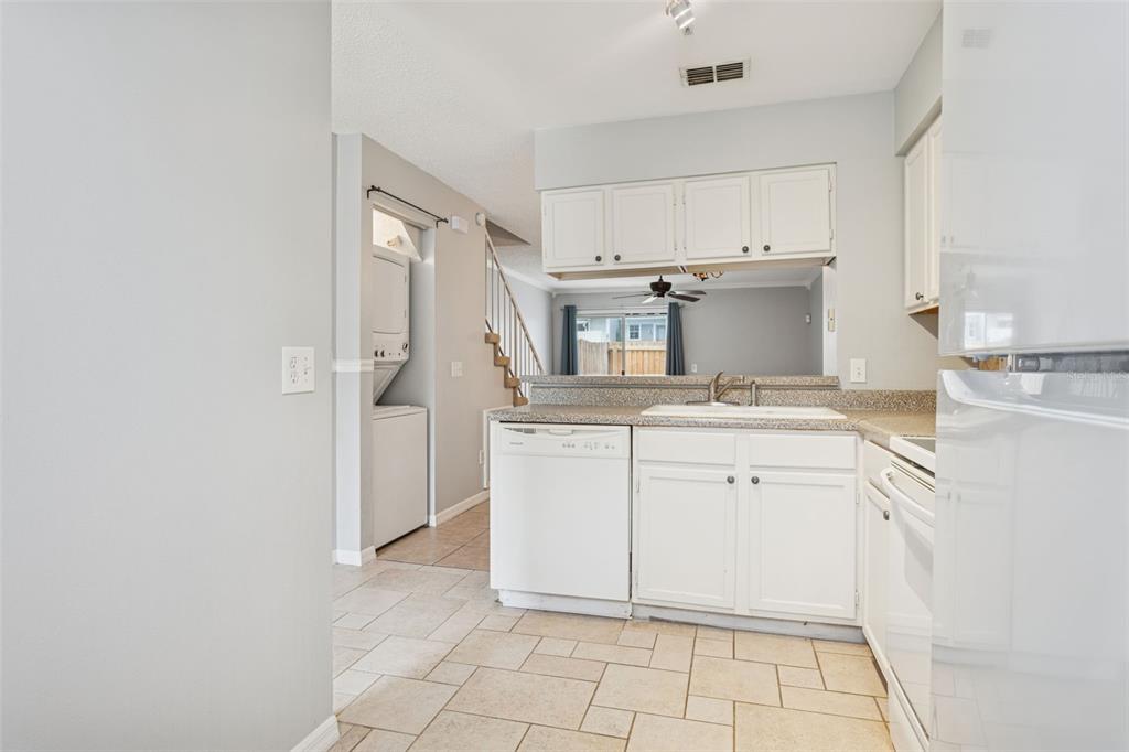 11356 Stratton Park Drive Temple Terrace, FL 33617 - Photo 8 of 25 a kitchen with white cabinets and white appliances