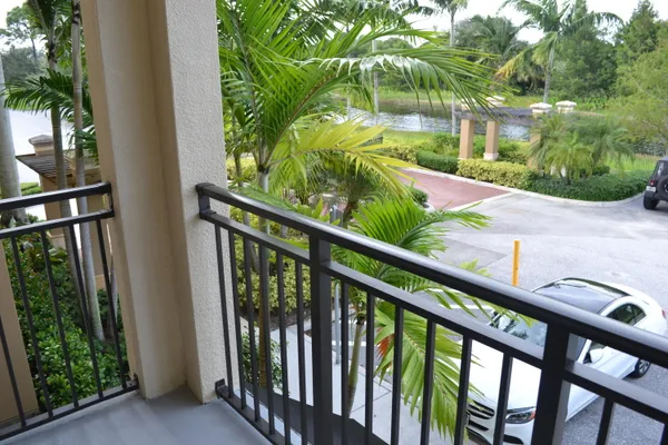a large bed sitting in a bedroom next to a lamp