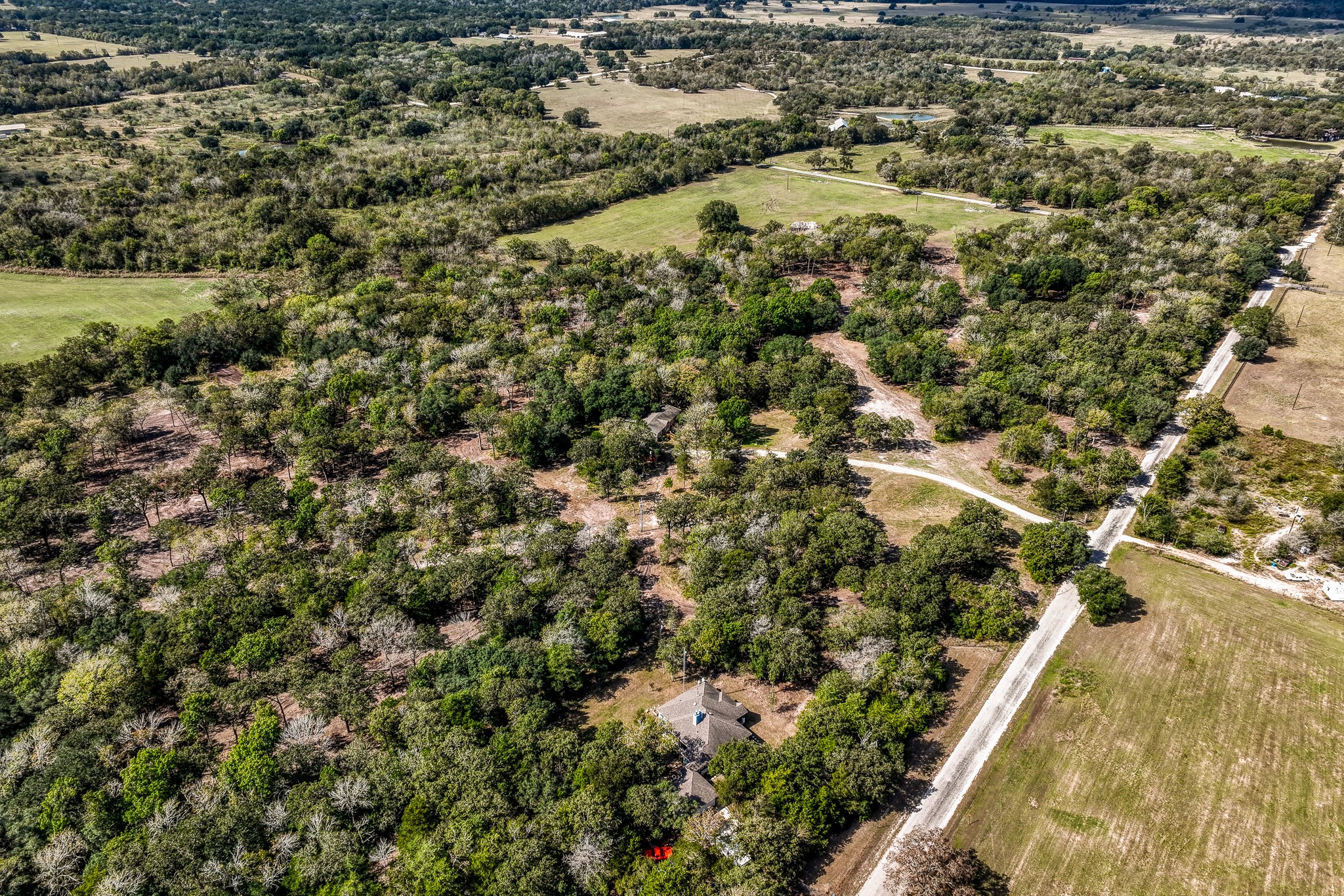 2 Sun Oil Road Brenham, TX 77833 - Photo 26 of 35 an aerial view of residential houses with outdoor space and trees