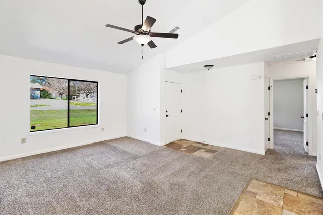a view of an empty room with a window