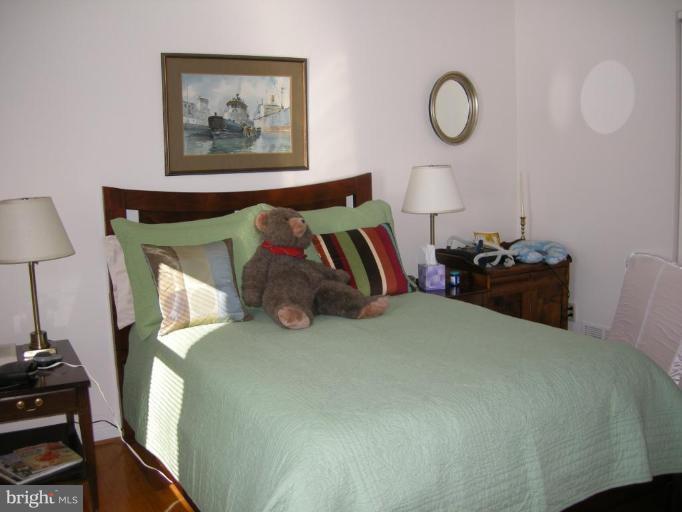 13221 Falls Road Cockeysville, MD 21030 - Photo 1 of 12 a bedroom with a bed and a painting on the wall