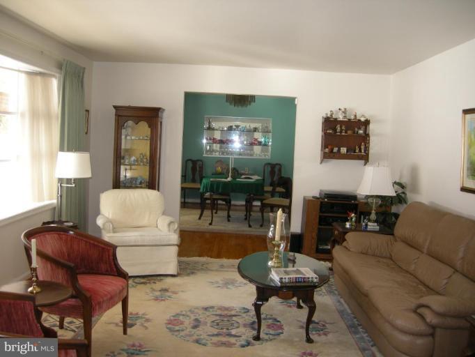 13221 Falls Road Cockeysville, MD 21030 - Photo 12 of 12 a living room with furniture and a flat screen tv