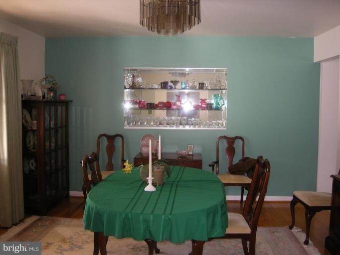 13221 Falls Road Cockeysville, MD 21030 - Photo 5 of 12 a view of a dining room with furniture and wooden floor