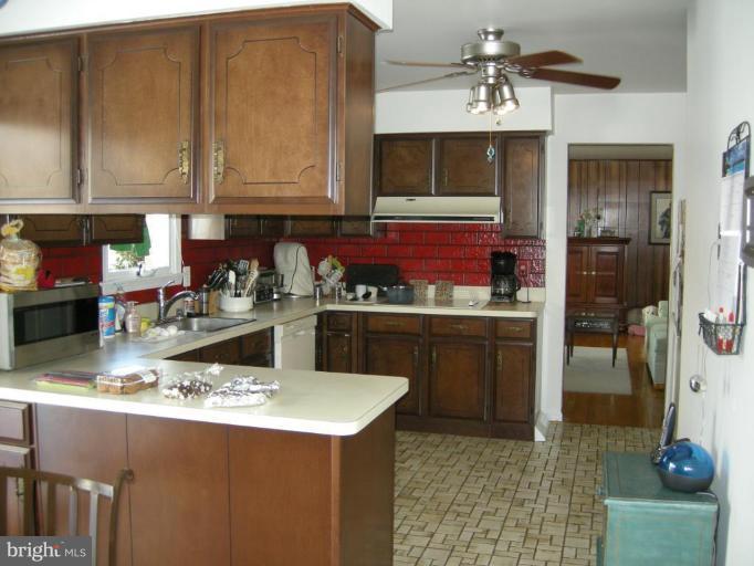 13221 Falls Road Cockeysville, MD 21030 - Photo 6 of 12 a kitchen with a sink and cabinets
