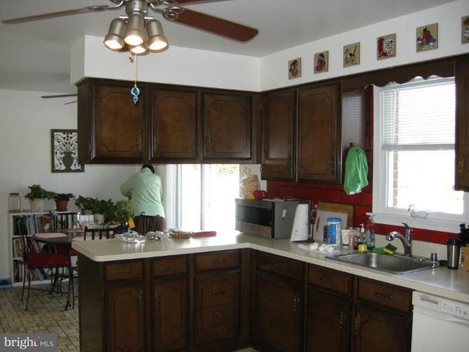 13221 Falls Road Cockeysville, MD 21030 - Photo 7 of 12 a kitchen with a sink cabinets and window
