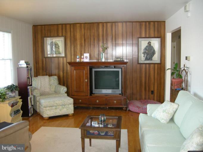 13221 Falls Road Cockeysville, MD 21030 - Photo 10 of 12 a living room with furniture and a fireplace