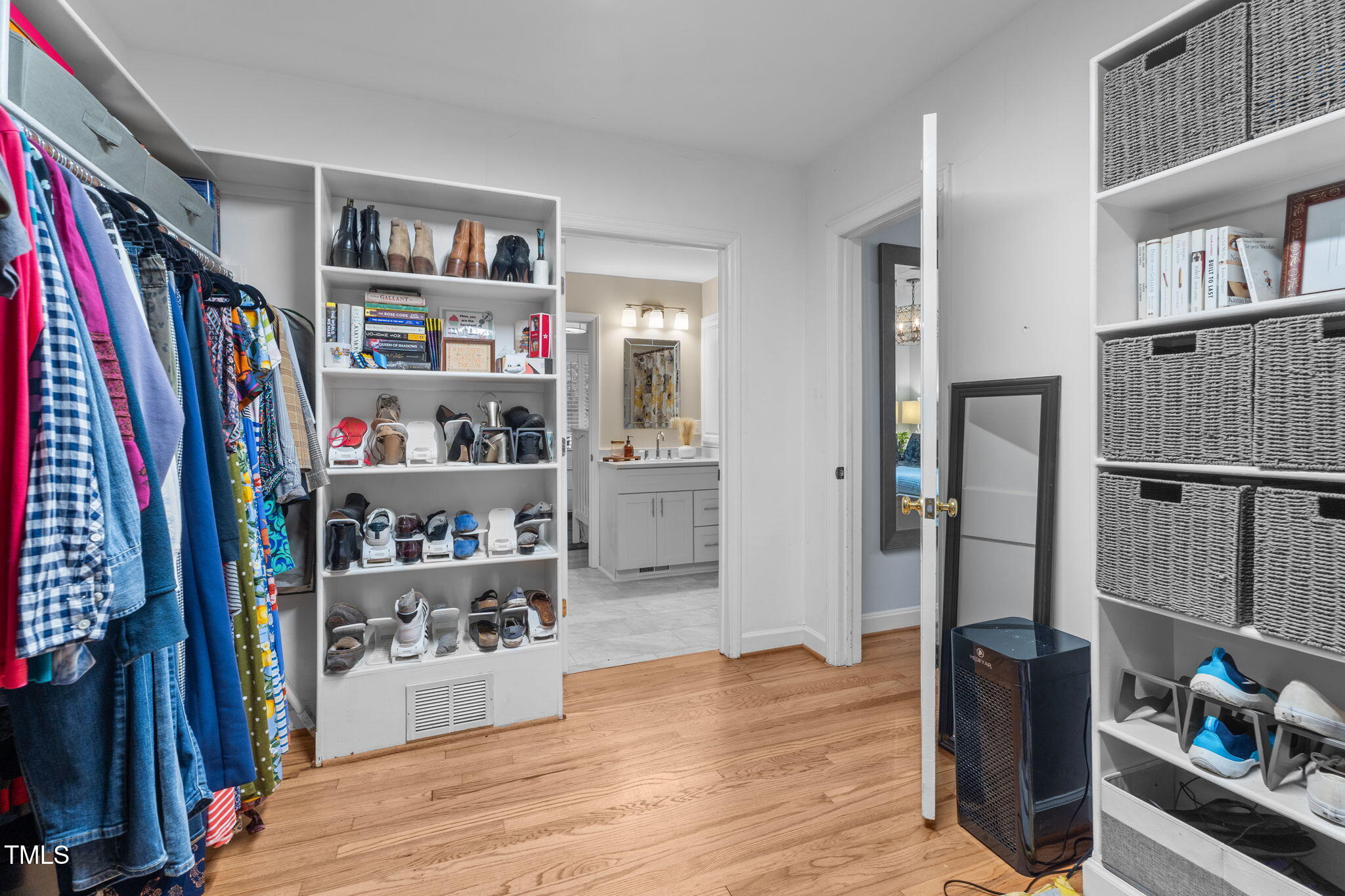 2918 Oberlin Road Raleigh, NC 27608 - Photo 17 of 26 a view of walk in closet with clothes and shoes