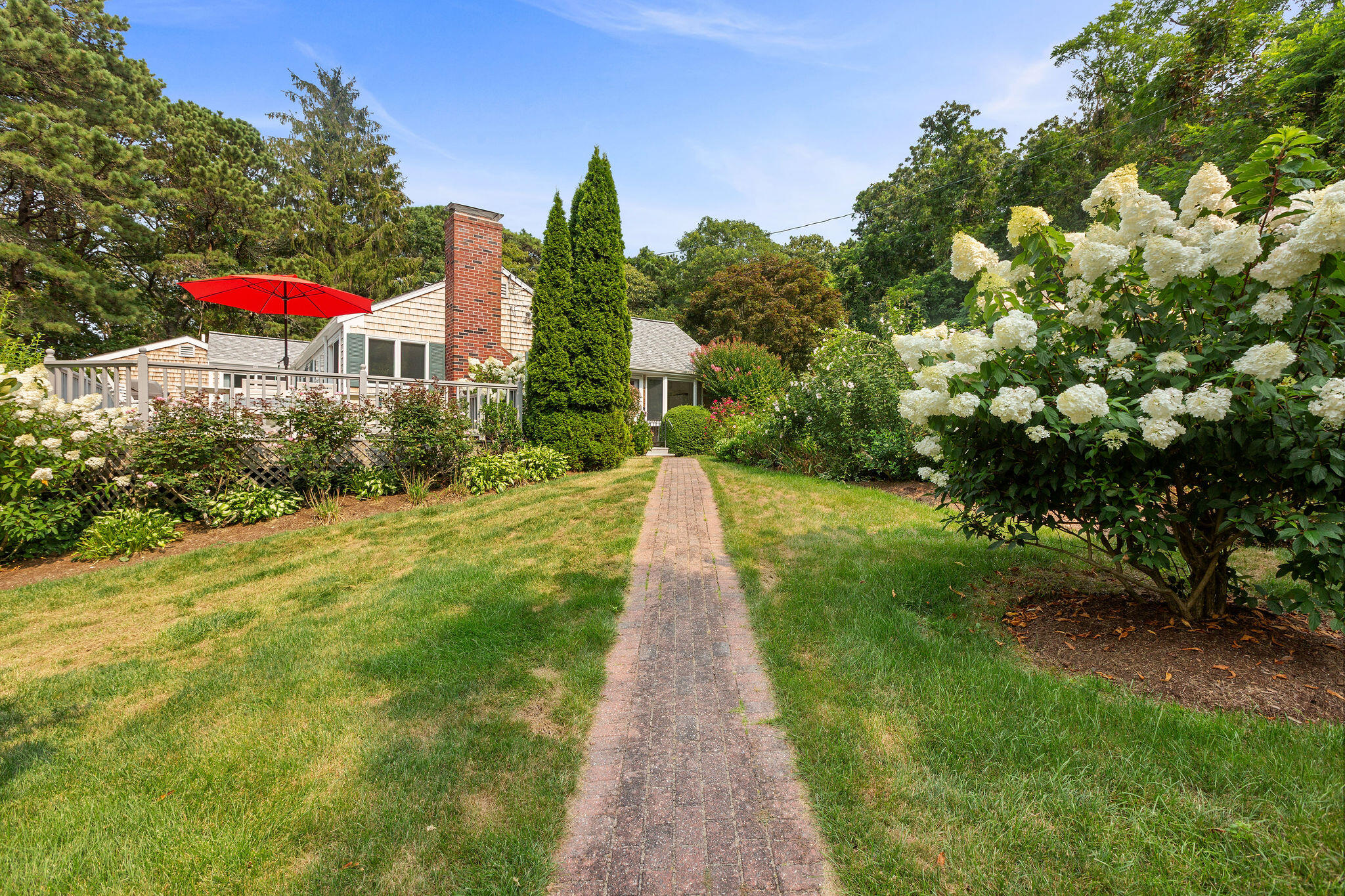 75 Monument Road Orleans, MA 02653 - Photo 1 of 61 a view of a pathway with a park