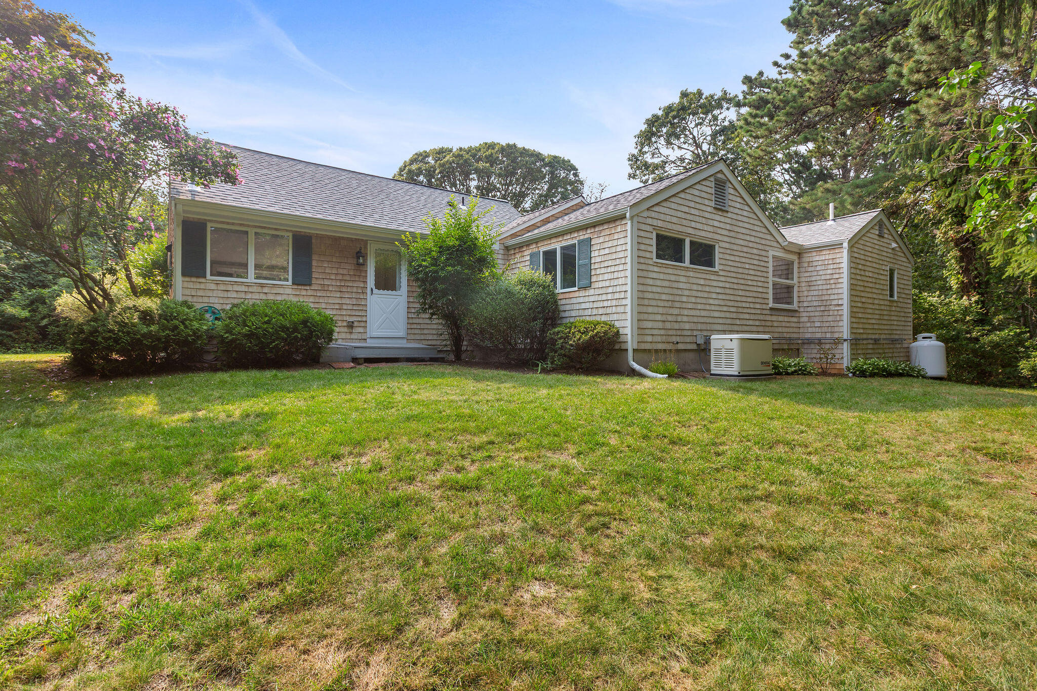 75 Monument Road Orleans, MA 02653 - Photo 14 of 61 a view of a house with backyard and garden