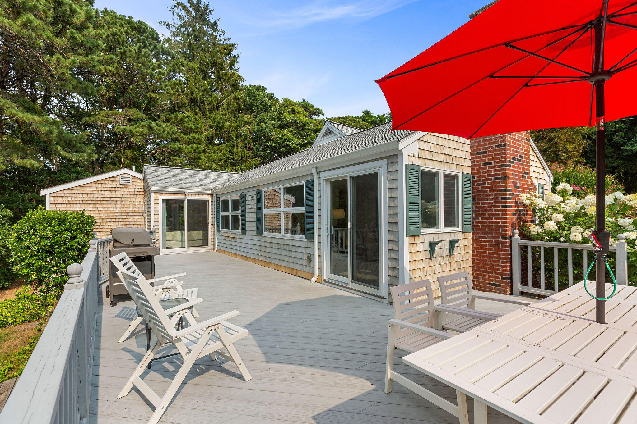 75 Monument Road Orleans, MA 02653 - Photo 18 of 61 a view of a house with backyard and sitting area