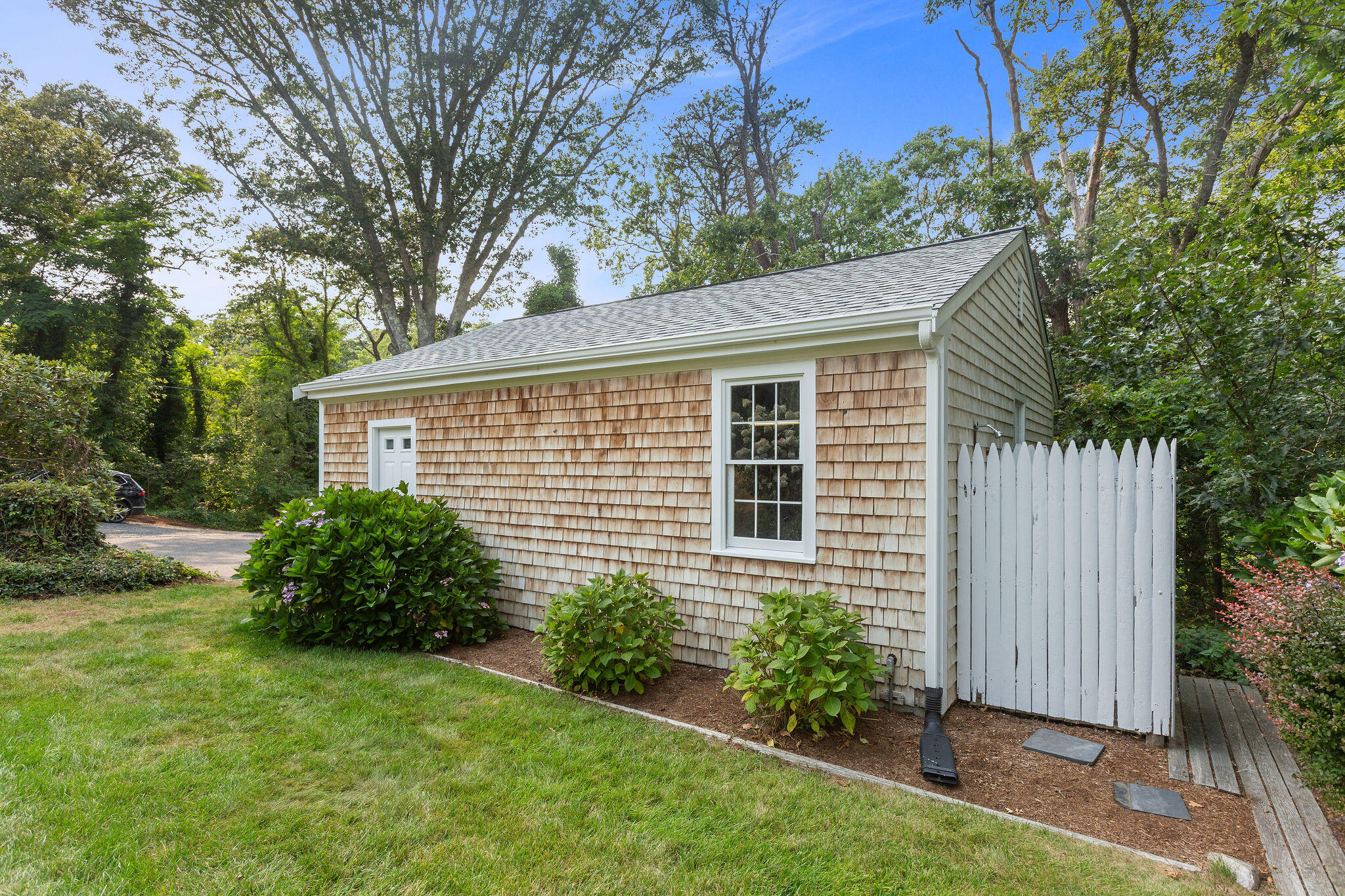 75 Monument Road Orleans, MA 02653 - Photo 24 of 61 a view of a house with a garden