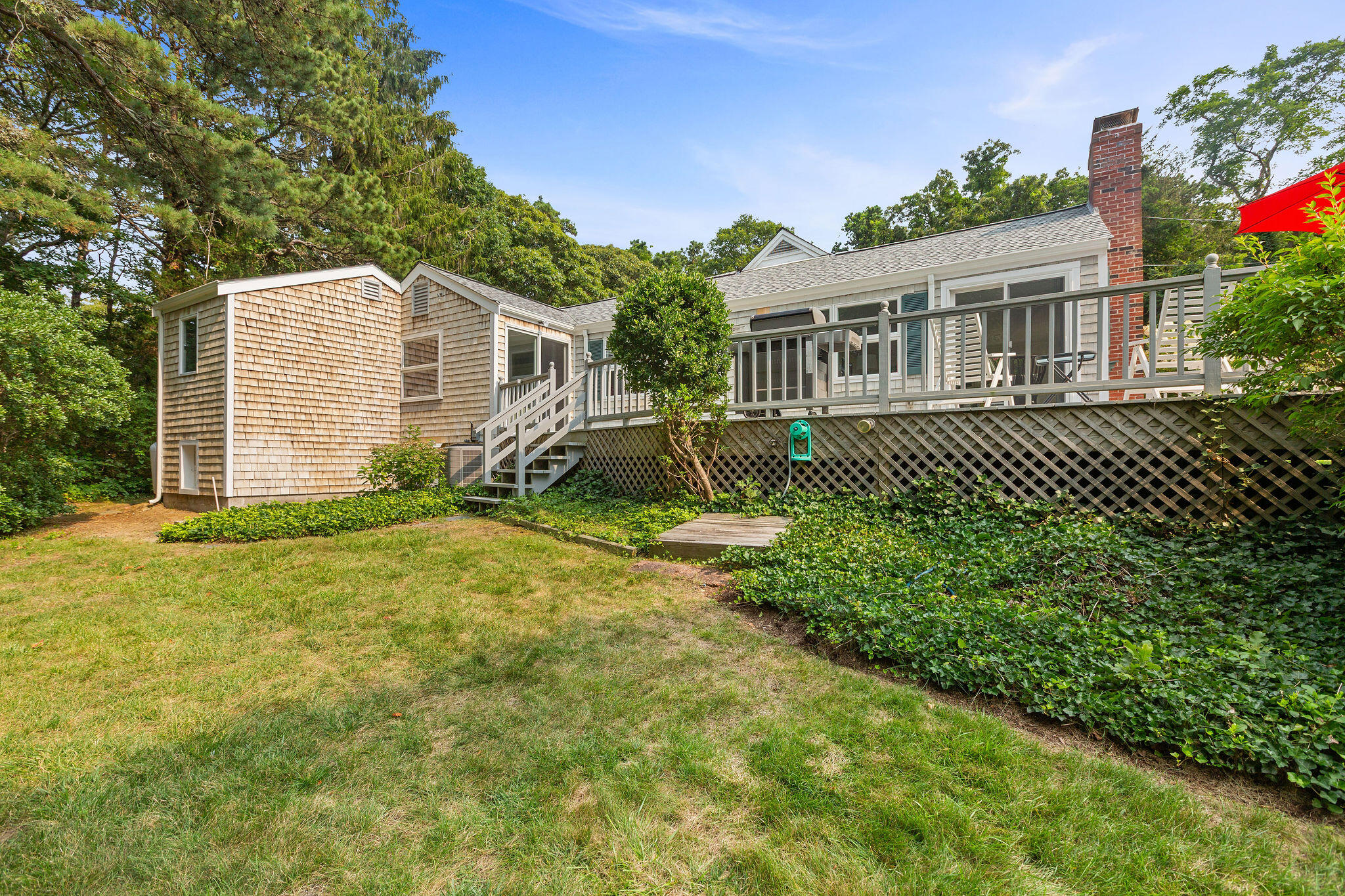 75 Monument Road Orleans, MA 02653 - Photo 26 of 61 a view of house with backyard and garden