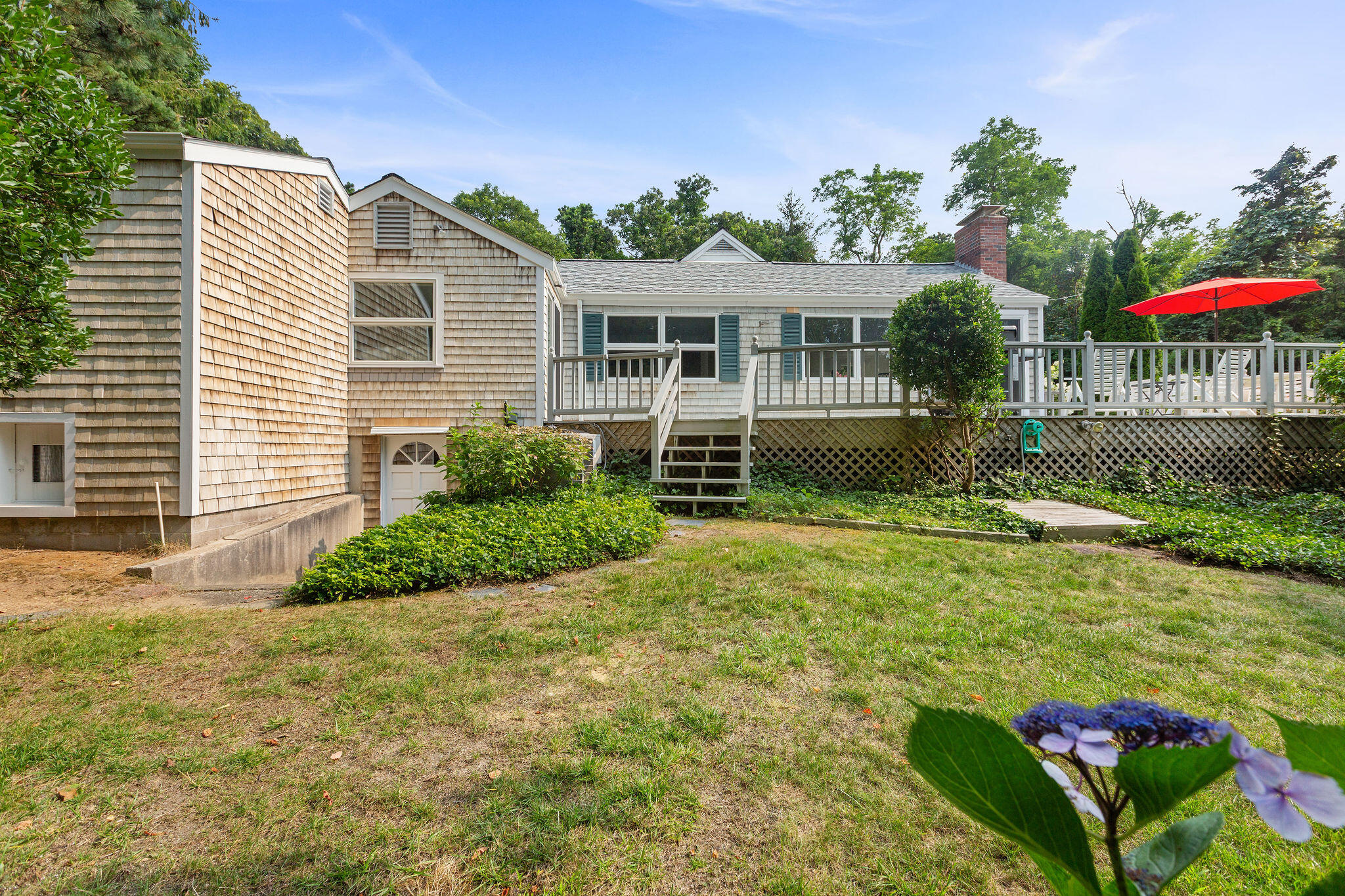 75 Monument Road Orleans, MA 02653 - Photo 27 of 61 a front view of a house with garden