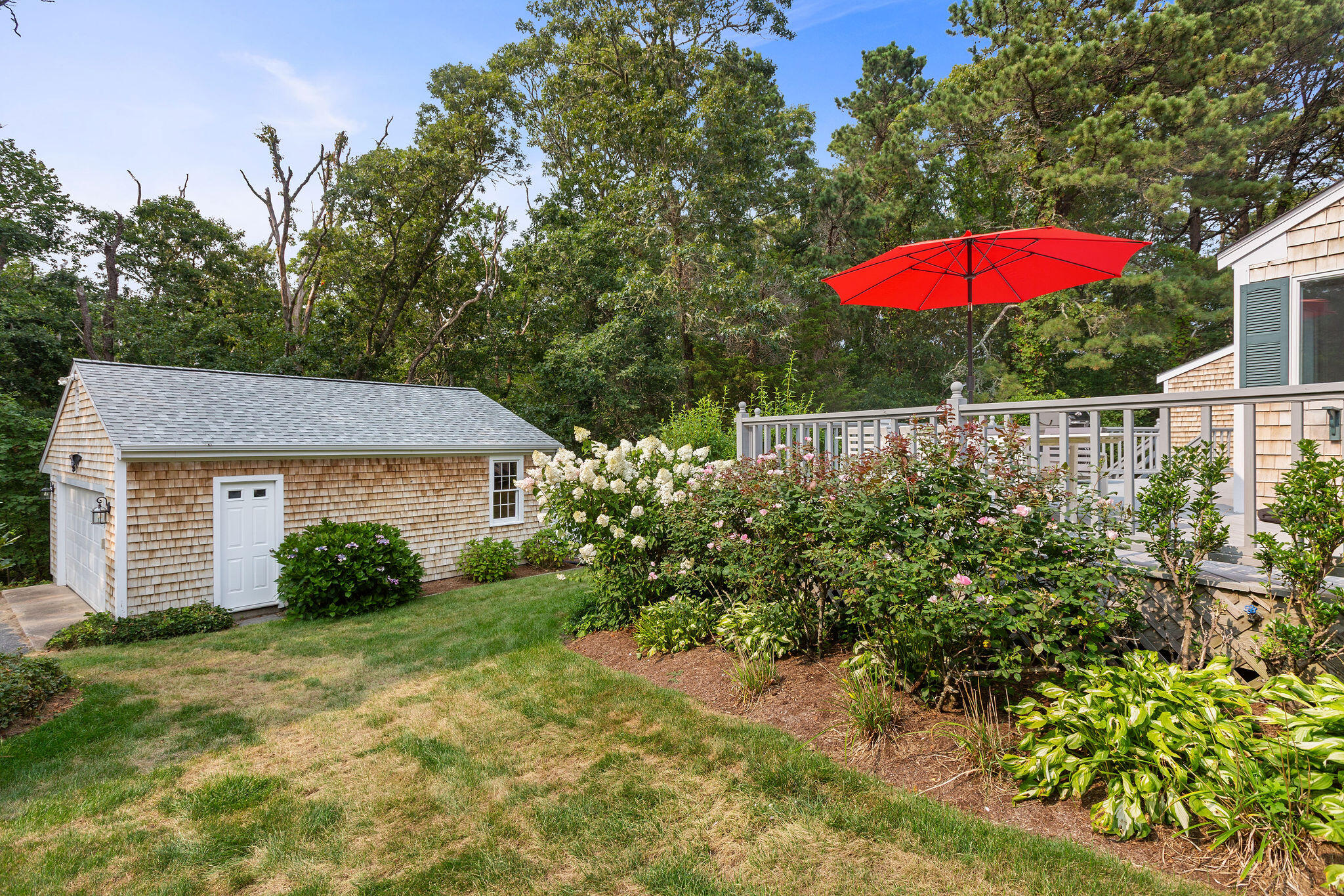 75 Monument Road Orleans, MA 02653 - Photo 3 of 61 a view of a house with a yard and porch