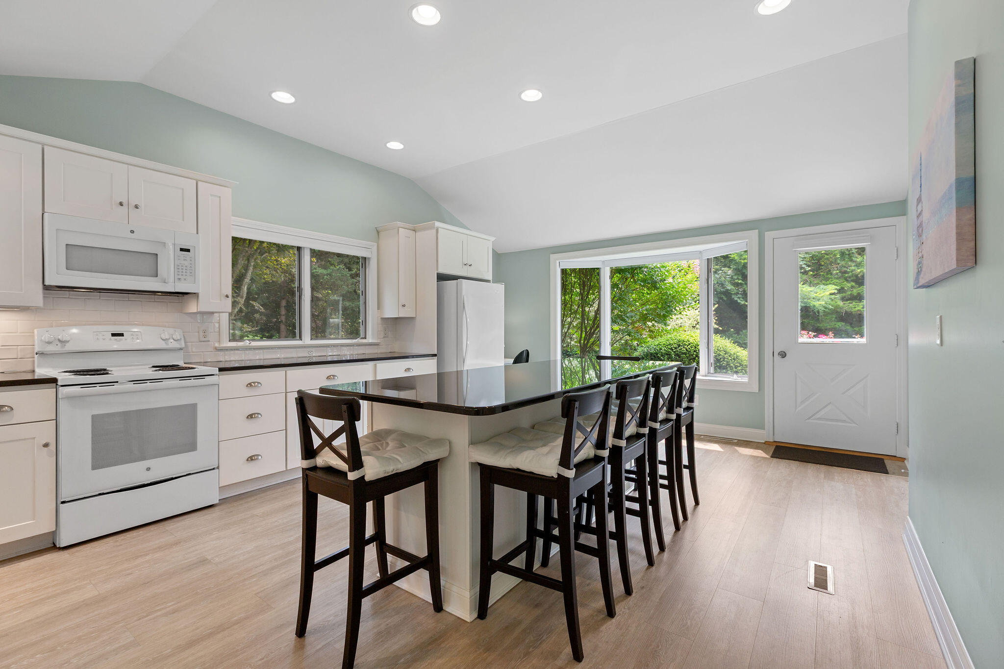 75 Monument Road Orleans, MA 02653 - Photo 34 of 61 a view of a dining room with furniture and wooden floor