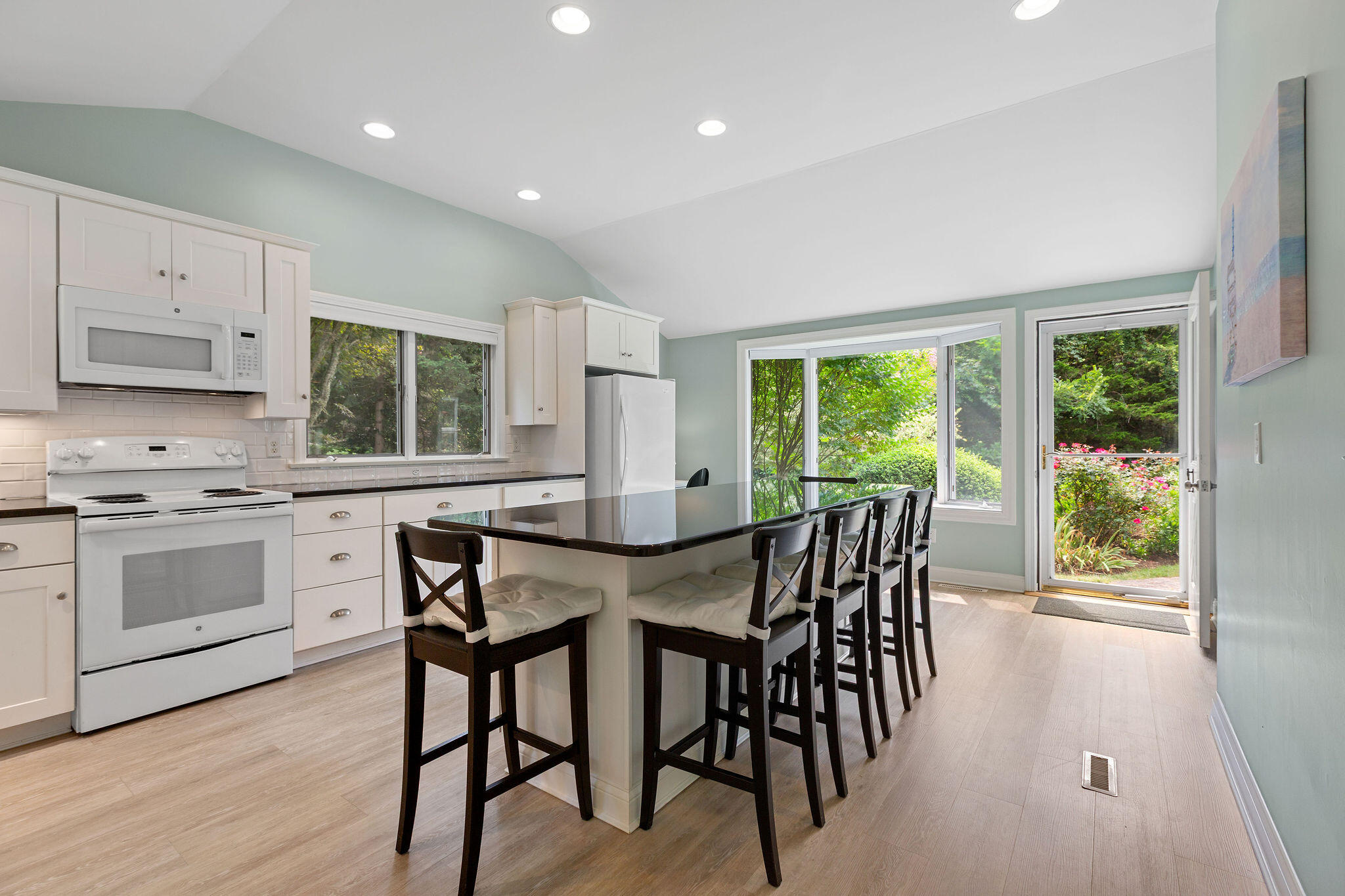 75 Monument Road Orleans, MA 02653 - Photo 35 of 61 a view of a dining room with furniture and wooden floor