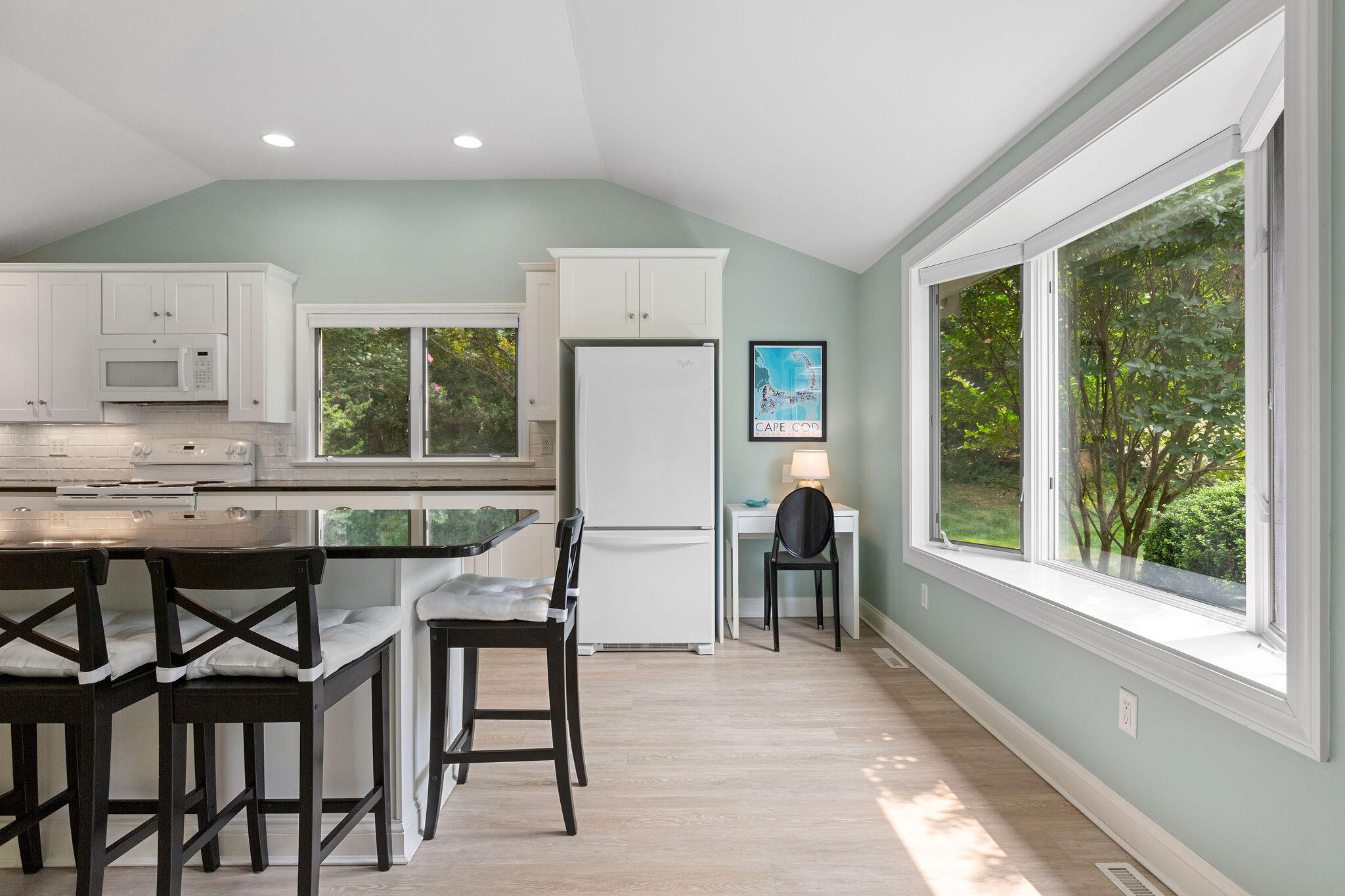 75 Monument Road Orleans, MA 02653 - Photo 36 of 61 a dining room with furniture and a large window