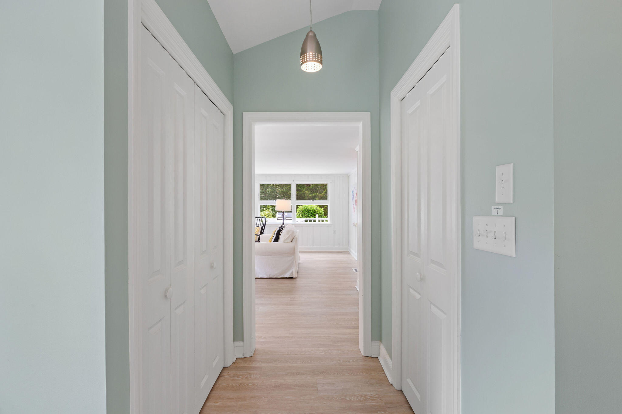 75 Monument Road Orleans, MA 02653 - Photo 37 of 61 a view of a hallway with a livingroom and a bathroom with a sink