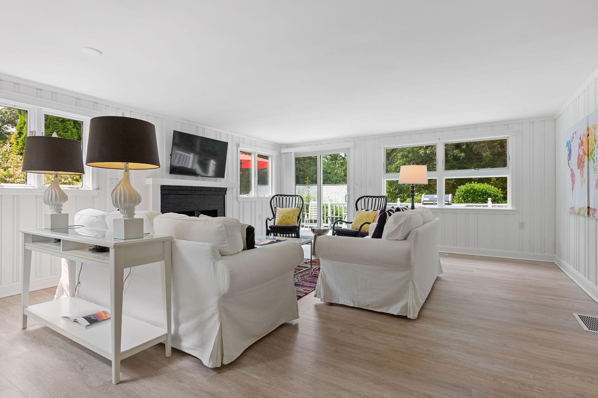 75 Monument Road Orleans, MA 02653 - Photo 38 of 61 a living room with furniture and a flat screen tv